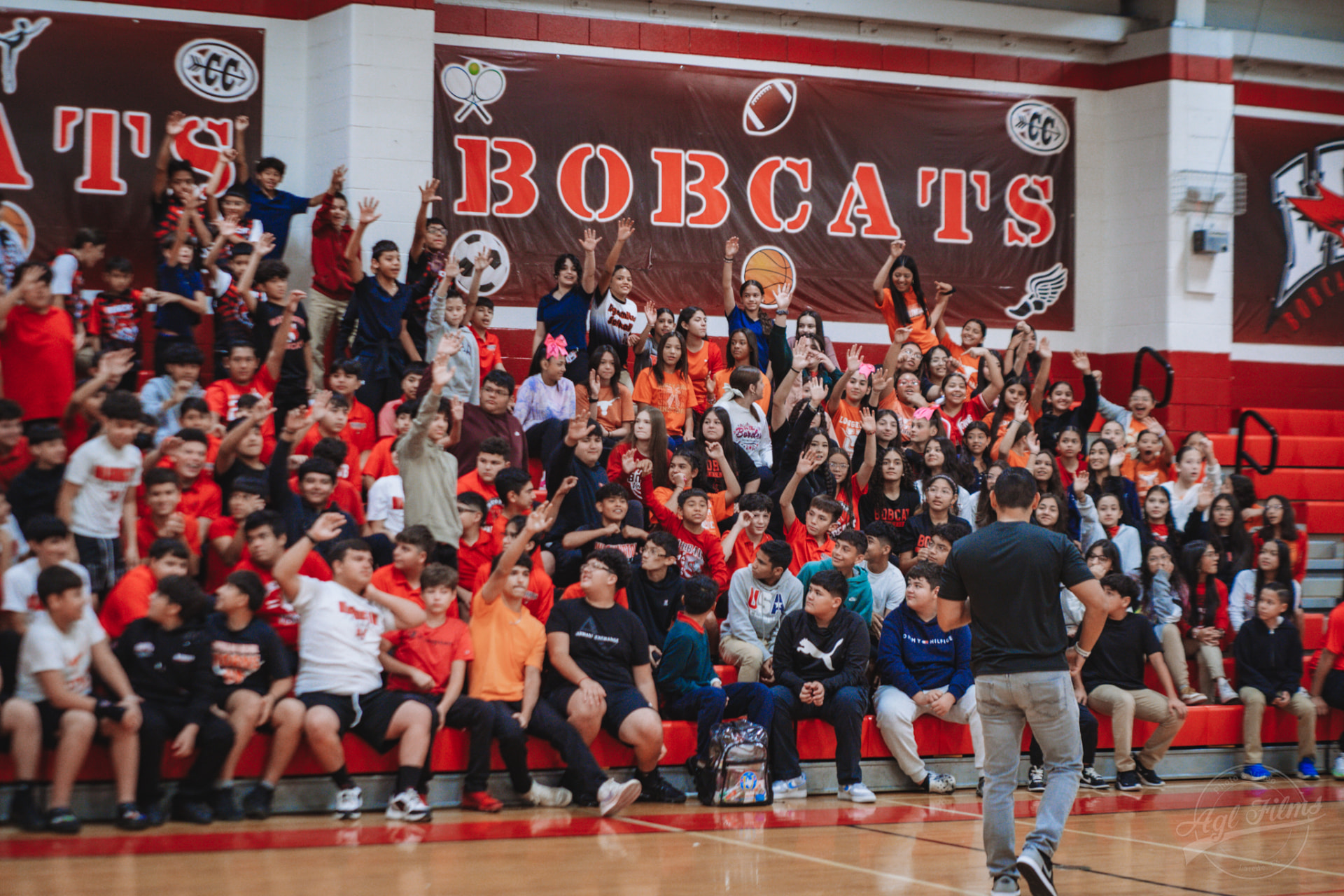 Daniel Rosas speaking to a packed Bobcats gym of students